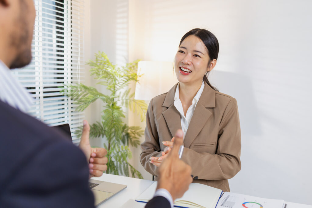 A sales representative asking a customer discovery questions